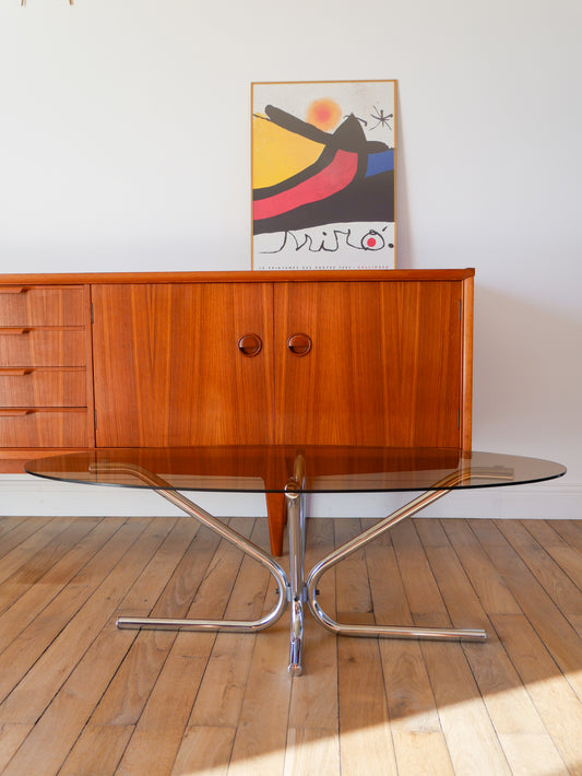 Table basse ovale en verre fumé piètements étoile en chrome design 1970