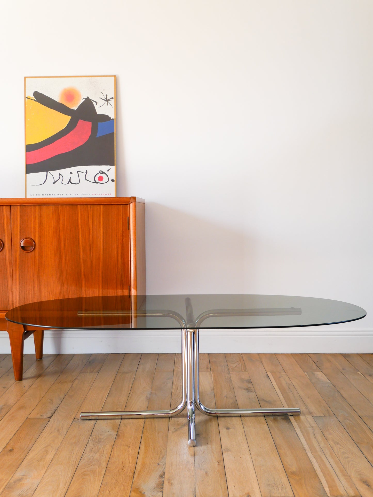 Table basse tubulaire ovale en verre et chrome, piètements étoile, Design, 1970